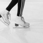 Figure skates on ice symbolizing Yuna Kim’s Sochi Olympics and dignity in sport