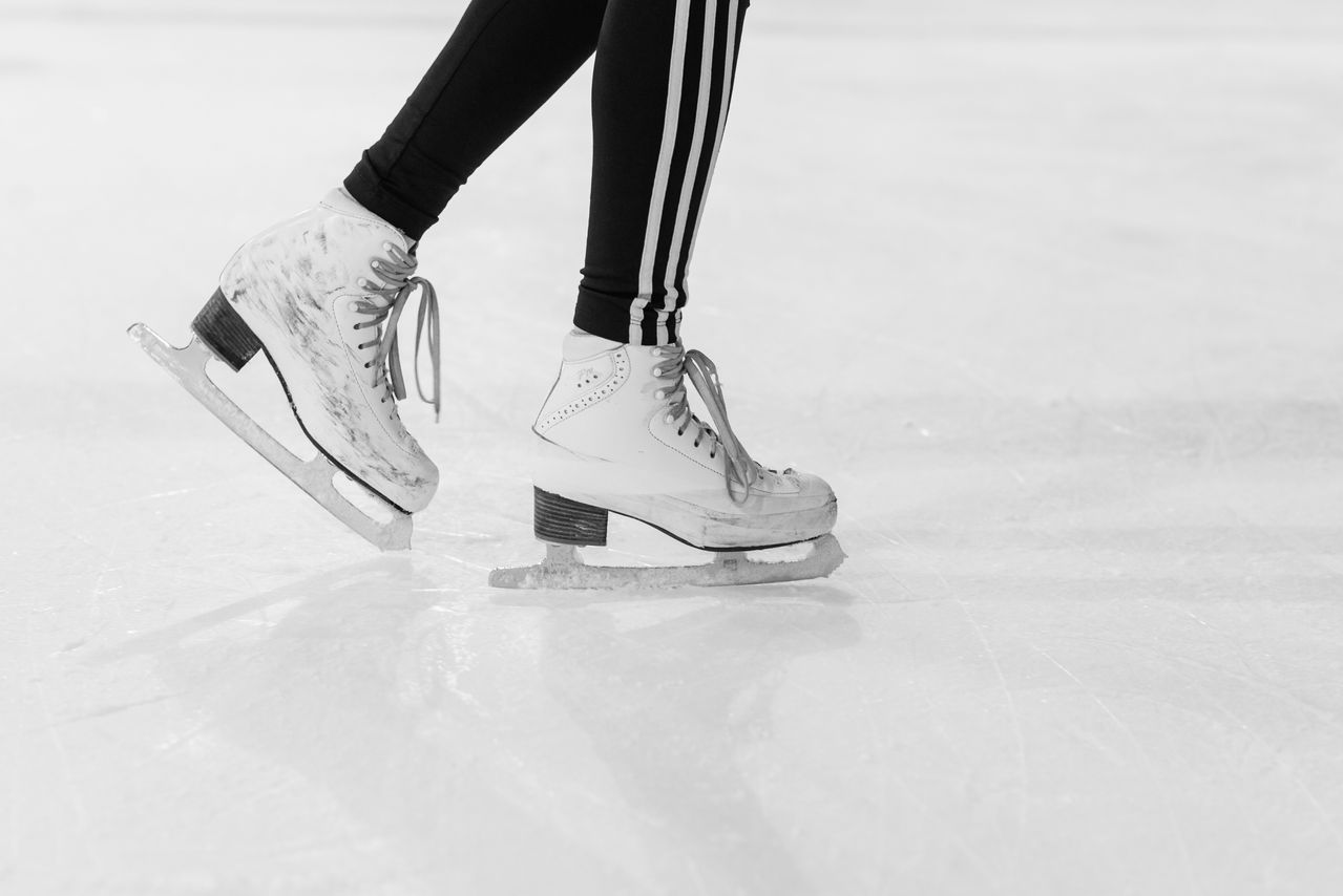 Figure skates on ice symbolizing Yuna Kim’s Sochi Olympics and dignity in sport