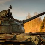 A weathered tank symbolizing war and the cost carried by ordinary people