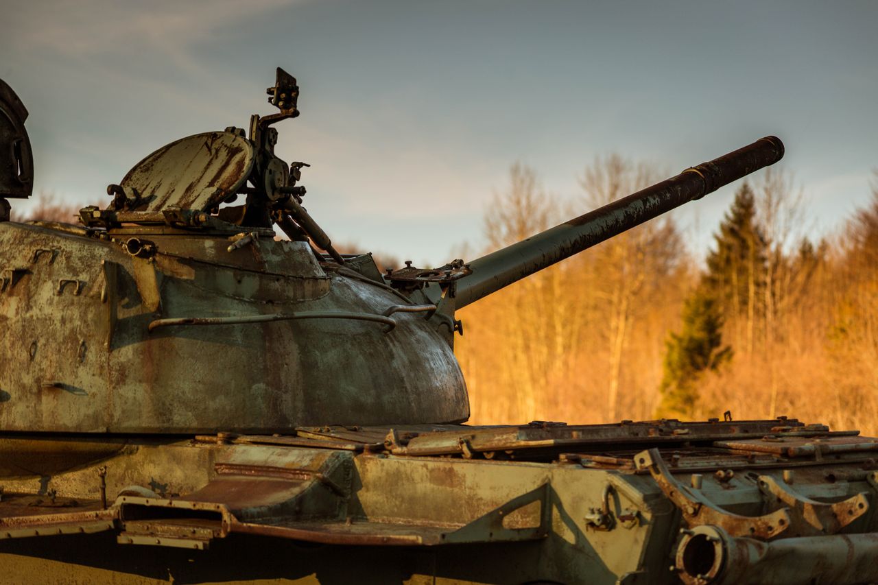 A weathered tank symbolizing war and the cost carried by ordinary people